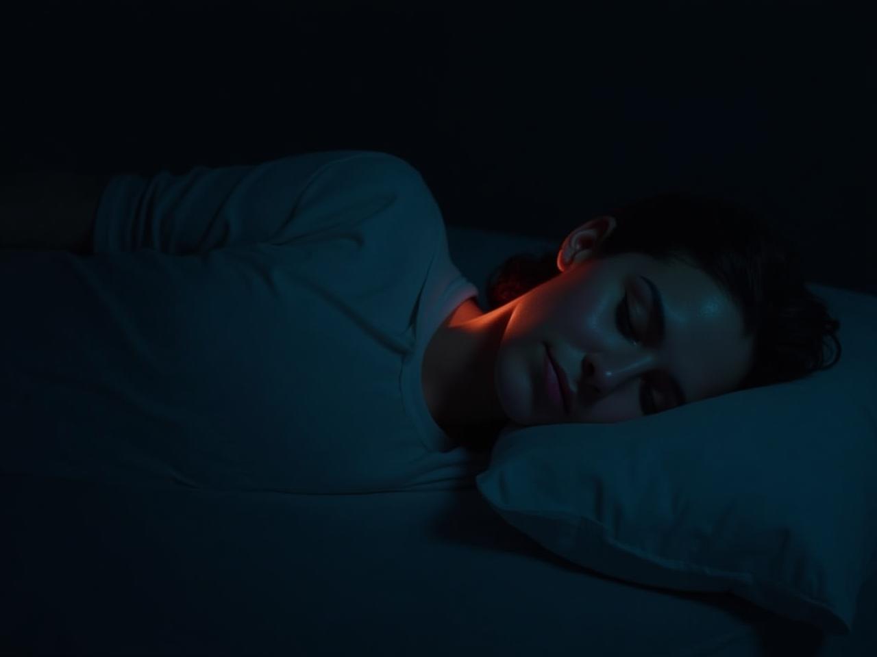 Person sleeping peacefully in a dark room, with a subtle image overlay of heart rate variability data.