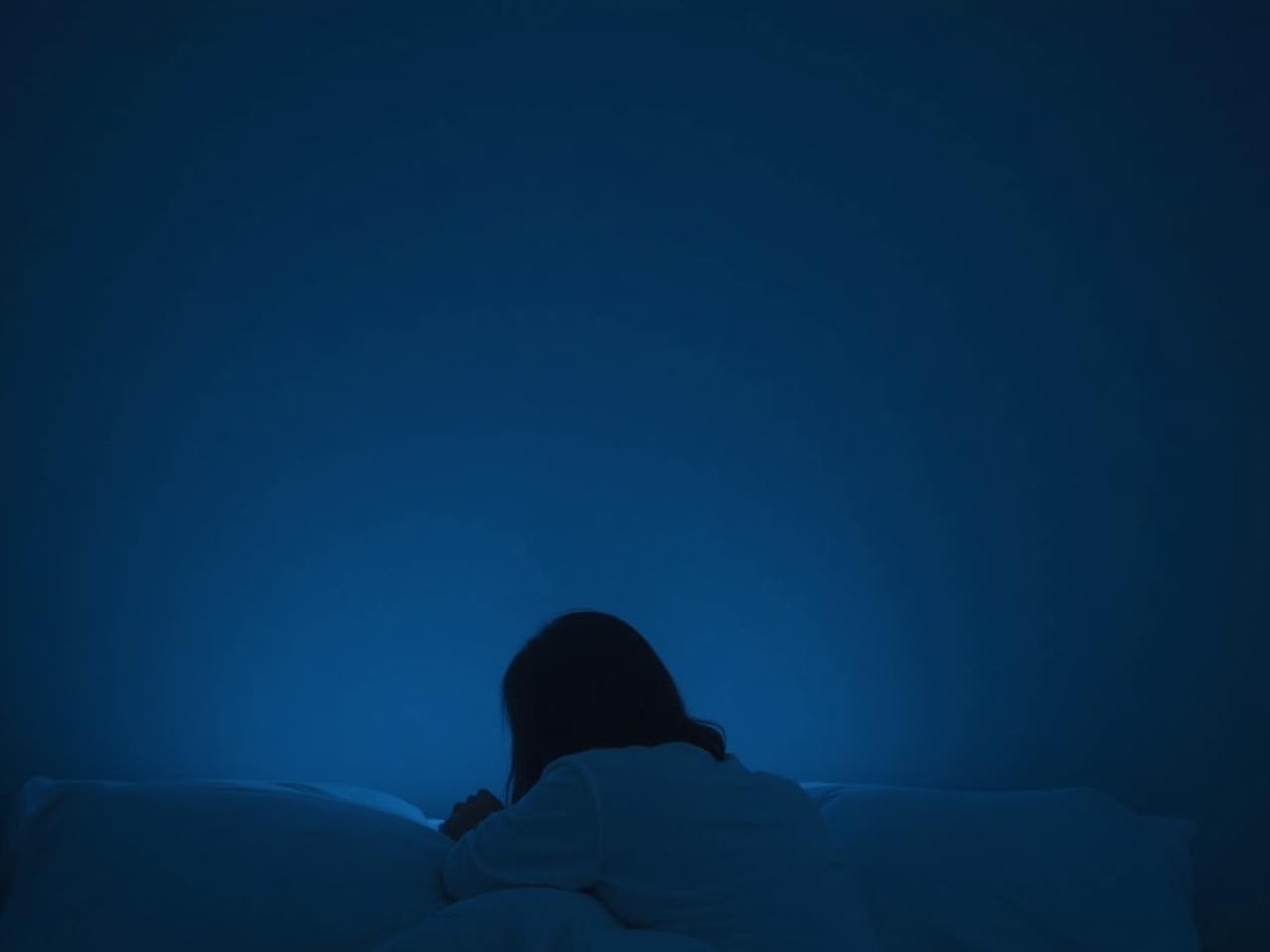 A person struggling to sleep in a room lit by a blue light.