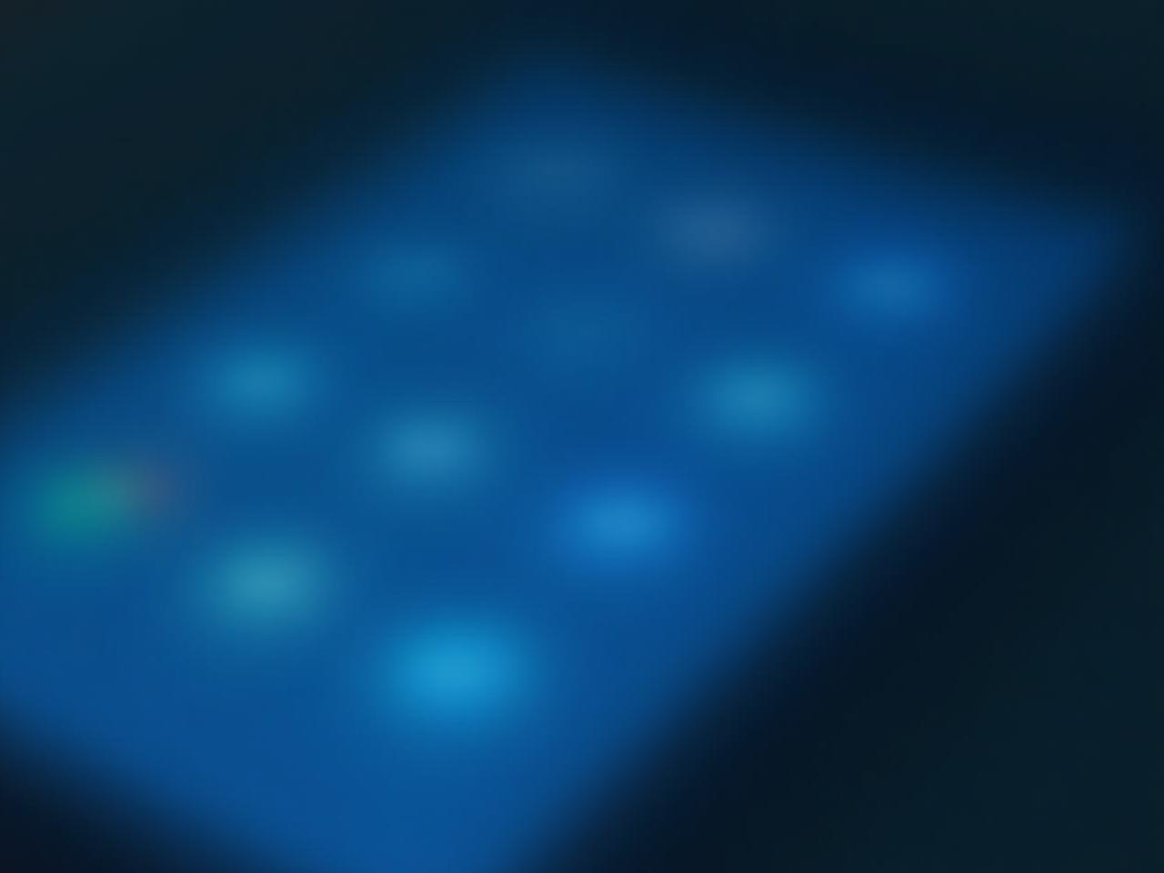 Close-up of a smartphone displaying social media icons, with a subtle blue tint emphasizing the potential for anxiety and addiction.